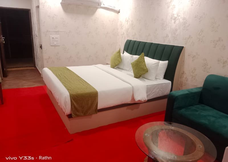 A boat house room with a framed print above the bed