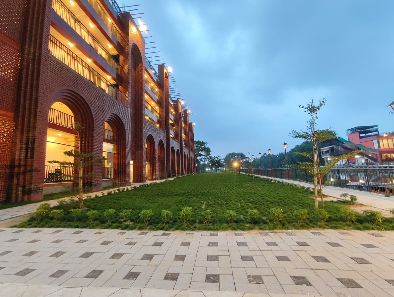 The building seen along its full length from the garden path